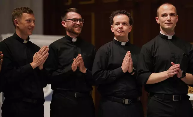 From left, the Rev. Joesph Connor, the Rev. Tim Banach, the Rev. John Meyerhofer, and the Rev. Mike Sampson, attend rehearsal for their ordination Mass at the Cathedral of Saint Thomas More in Arlington, Va., on Friday, June 6, 2025. (AP Photo/Jessie Wardarski)