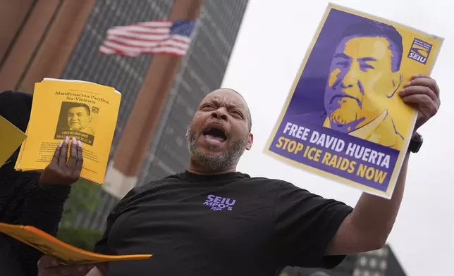 People gather to protest the deployment of the National Guard in Los Angeles and the detainment of union leader David Huerta near Independence Hall in Philadelphia, Monday, June 9, 2025. (AP Photo/Matt Rourke)