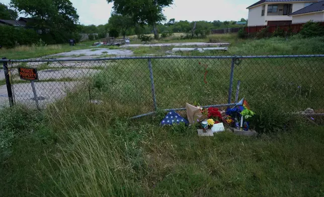 Candles, flowers, and notes make up make-shift memorial for voice actor Jonathan Joss who was recently killed, Tuesday, June 3, 2025, in San Antonio. (AP Photo/Eric Gay)
