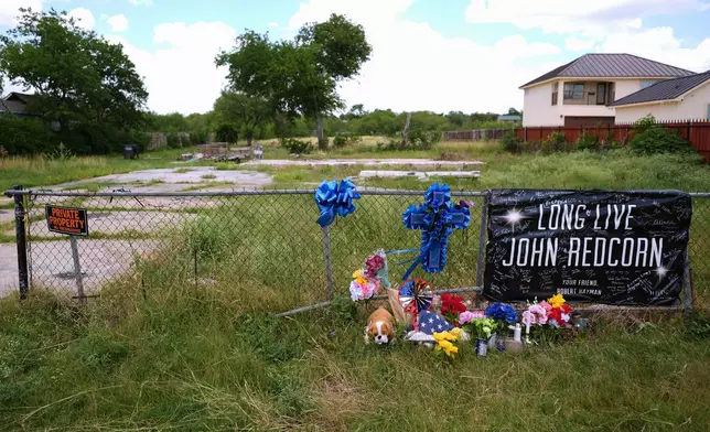 Candles, flowers, and notes are placed at a makeshift memorial in San Antonio, on Thursday, June 5, 2025, for voice actor Jonathan Joss who was recently killed. (AP Photo/Eric Gay)