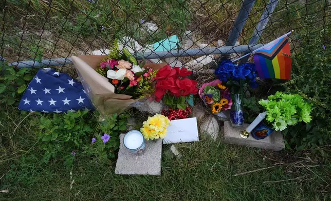 Candles, flowers, and notes make up make-shift memorial for voice actor Jonathan Joss who was recently killed, Tuesday, June 3, 2025, in San Antonio. (AP Photo/Eric Gay)