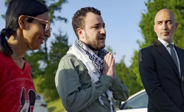 Palestinian activist and former Columbia University graduate student Mahmoud Khalil, center, speaks after his release from federal immigration detention in Jena, La., Friday, June 20, 2025. (AP Photo/Matthew Hinton)