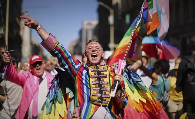 A participant in the Pride march cheers in Budapest, Hungary, Saturday, June 28, 2025. (AP Photo/Rudolf Karancsi)