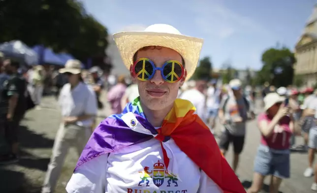 A participant poses as people start gathering for the Pride march in Budapest, Hungary, Saturday, June 28, 2025. (AP Photo/Rudolf Karancsi)