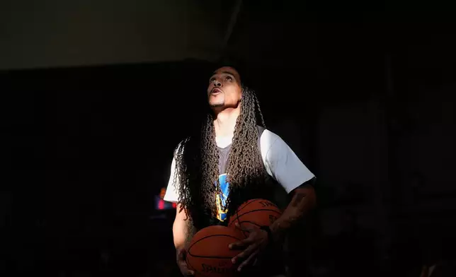 Jonah Dillingham performs basketball drills with other Twinning Project cohort 2 participants during the project's collaboration with the NBA's Golden State Warriors and the California Department of Corrections and Rehabilitation at Solano State Prison in Vacaville, Calif., Tuesday, Feb. 11, 2025. (AP Photo/Jeff Chiu)