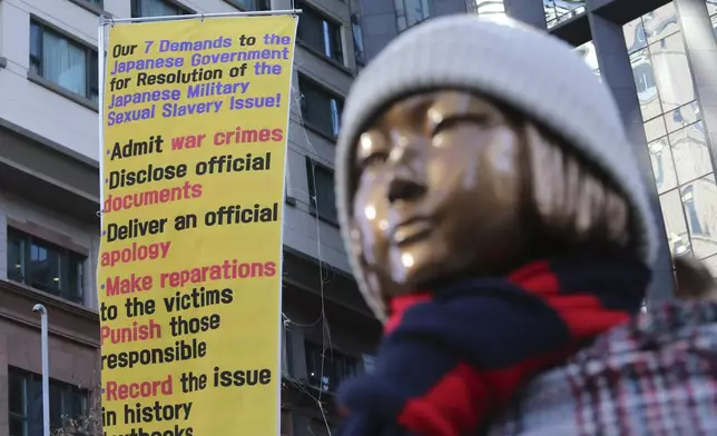 FILE - A statue symbolizing a wartime sex slave is displayed near the Japanese Embassy in Seoul, South Korea, on Jan. 8, 2021. (AP Photo/Ahn Young-joon, File)