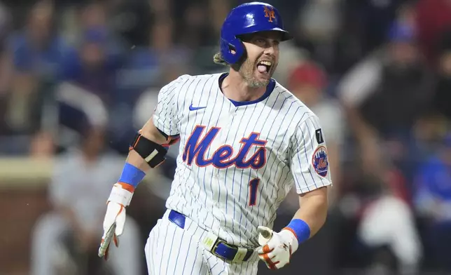 New York Mets' Jeff McNeil (1) reacts as he runs to second base for a walk-off RBI double during the 10th inning of a baseball game against the Washington Nationals Tuesday, June 10, 2025, in New York. (AP Photo/Frank Franklin II)