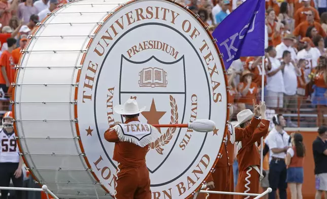 FILE - Texas' "Big Bertha" bass drum is played before the start of an NCAA college football game against Oklahoma State, Saturday, Oct. 21, 2017, in Austin, Texas. (AP Photo/Michael Thomas, File)