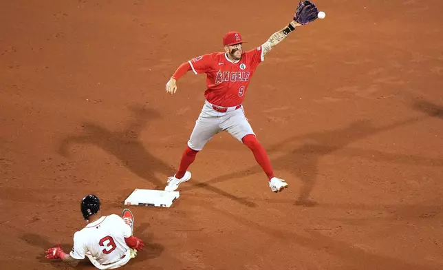 Los Angeles Angels shortstop Zach Neto makes the out at second on Boston Red Sox's Ceddanne Rafaela during the sixth inning of a baseball game, Monday, June 2, 2025, in Boston. (AP Photo/Robert F. Bukaty)