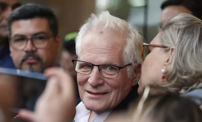 Miguel Uribe Londono, the father of Colombian senator and presidential candidate Miguel Uribe Turbay, who was shot during a campaign rally, speaks with the press outside the clinic where Uribe Turbay is being treated, in Bogota, Colombia, Monday, June 9, 2025. (AP Photo/John Vizcaino)
