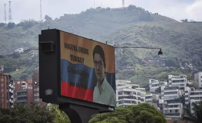 A billboard that reads in Spanish, "Miguel Uribe Turbay, Colombia prays for your life" is seen in Cali, Colombia, Sunday, June 8, 2025, after the senator was shot at a political rally. (AP Photo/Santiago Saldarriaga)