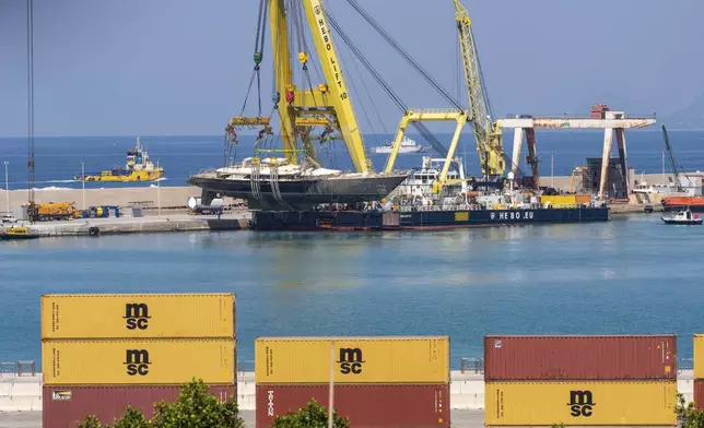 The hull of the superyacht Bayesian, which sank near Palermo, Sicily, on August 19, 2024, is taken to the shipyard in Termini Imerese, Italy, Sunday, June 22, 2025. (AP Photo/Salvatore Cavalli)
