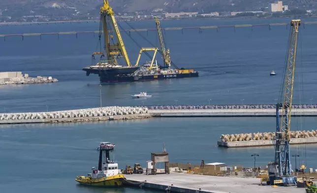 The hull of the superyacht Bayesian, which sank near Palermo, Sicily, on August 19, 2024, is taken to the shipyard in Termini Imerese, Italy, Sunday, June 22, 2025. (AP Photo/Salvatore Cavalli)