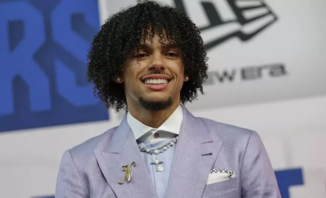Asa Newell arrives for the first round of the NBA basketball draft, Wednesday, June 25, 2025, in New York. (AP Photo/Adam Hunger)