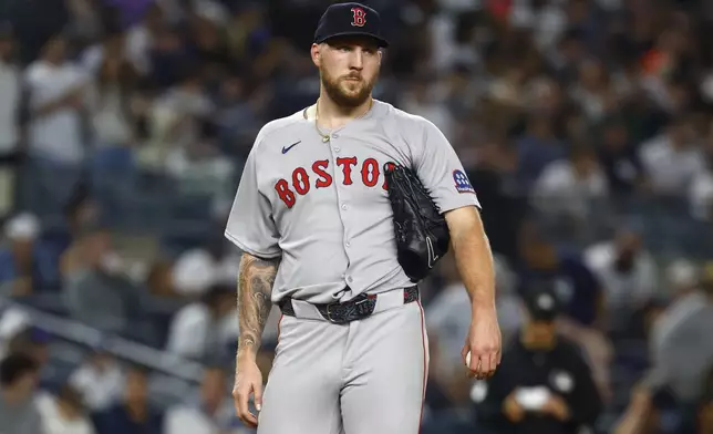 Boston Red Sox pitcher Garrett Crochet reacts after giving up an RBI double to New York Yankees' Austin Wells during the fourth inning of a baseball game, Saturday, June 7, 2025, in New York. (AP Photo/Noah K. Murray)