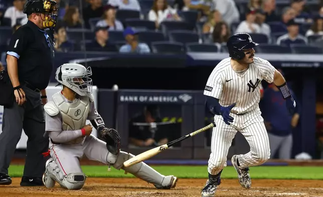 New York Yankees' Austin Wells tosses his bat after hitting a double against the Boston Red Sox during the fourth inning of a baseball game, Saturday, June 7, 2025, in New York. (AP Photo/Noah K. Murray)
