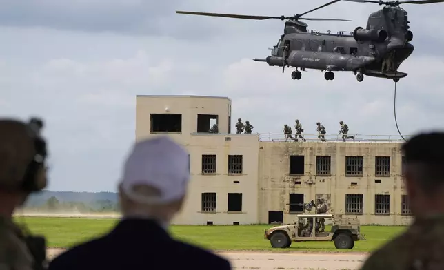 President Donald Trump observes a special operations command demonstration at Fort Bragg, Tuesday, June 10, 2025, in Fort Bragg, N.C. (AP Photo/Alex Brandon)