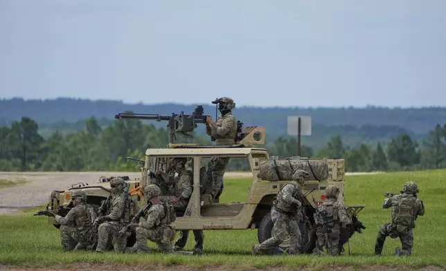 President Donald Trump observes a special operations command demonstration at Fort Bragg, Tuesday, June 10, 2025, in Fort Bragg, N.C. (AP Photo/Alex Brandon)