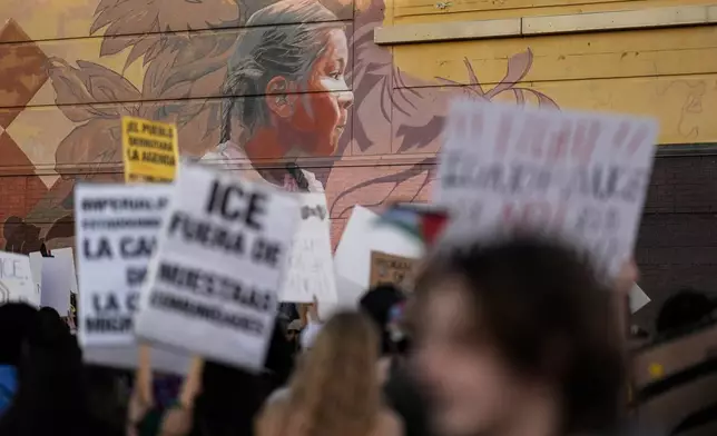 Protesters march during an immigration demonstration, Tuesday, June 10, 2025, in Brookhaven, Ga., near Atlanta. (AP Photo/Mike Stewart)