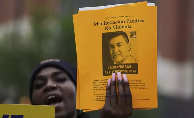 People gather to protest the deployment of the National Guard in Los Angeles and the detainment of union leader David Huerta near Independence Hall in Philadelphia, Monday, June 9, 2025. (AP Photo/Matt Rourke)