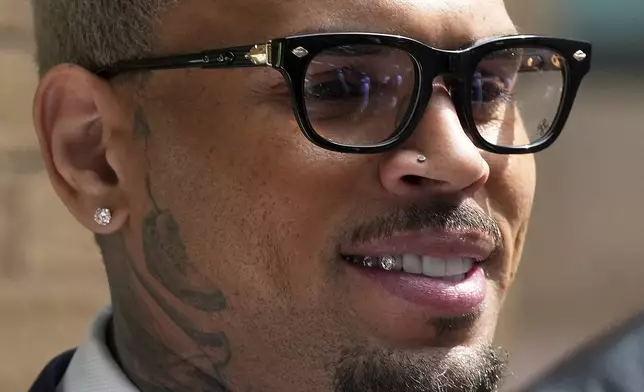 US R&amp;B singer Chris Brown leaves Southwark Crown Court after attending a plea hearing in London, Friday, June 20, 2025.(AP Photo/Frank Augstein)