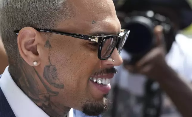 US R&amp;B singer Chris Brown leaves Southwark Crown Court after attending a plea hearing in London, Friday, June 20, 2025.(AP Photo/Frank Augstein)
