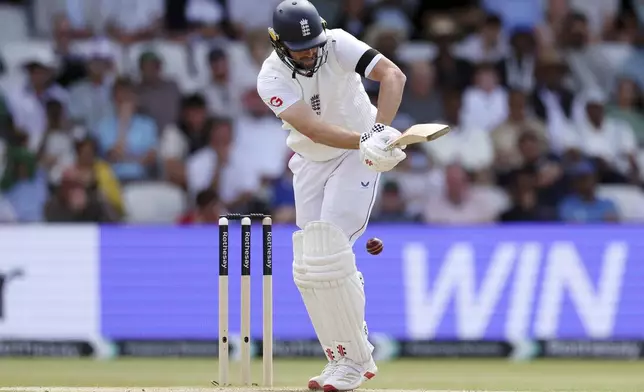 England's Chris Woakes plays his shot during day three of the first cricket test match between England and India at Headingley in Leeds, England, Sunday, June. 22, 2025. (AP Photo/Scott Heppell)