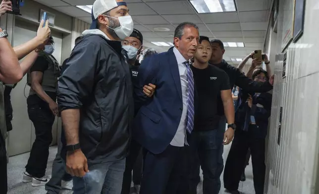 New York City Comptroller Brad Lander is placed under arrest by Immigration and Customs Enforcement (ICE) and FBI agents outside federal immigration court on Tuesday, June 17, 2025, in New York. (AP Photo/Olga Fedorova)