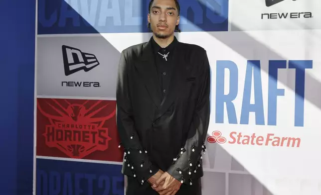 Noa Essengue arrives for the first round of the NBA basketball draft, Wednesday, June 25, 2025, in New York. (AP Photo/Adam Hunger)