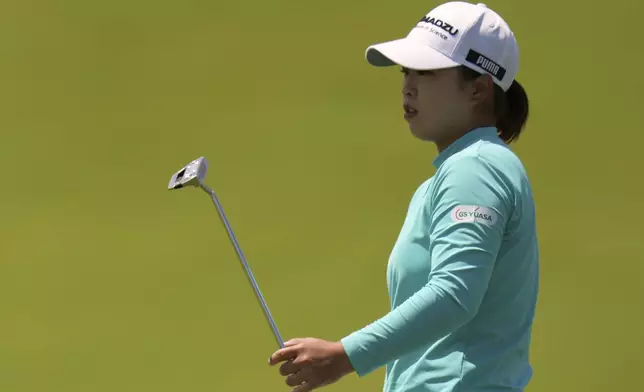 Mao Saigo, of Japan, reacts to missed putt on the fifth hole during the third round of the U.S. Women's Open golf tournament at Erin Hills Saturday, May 31, 2025, in Erin, Wis. (AP Photo/Jeff Roberson)