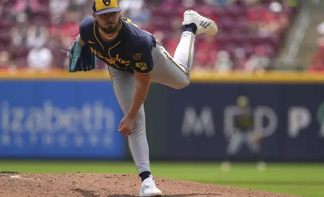 Milwaukee Brewers' DL Hall follows through on a pitch in the second inning of a baseball game against the Cincinnati Reds, Wednesday, June 4, 2025, in Cincinnati. (AP Photo/Kareem Elgazzar)