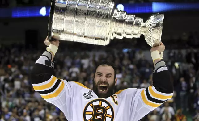 FILE - Boston Bruins' Zdeno Chara, of Slovakia, hoists the cup following the Bruins' 4-0 win over the Vancouver Canucks in Game 7 of the NHL hockey Stanley Cup Finals on June 15, 2011, in Vancouver, British Columbia, Canada. (Jonathan Hayward/The Canadian Press via AP)