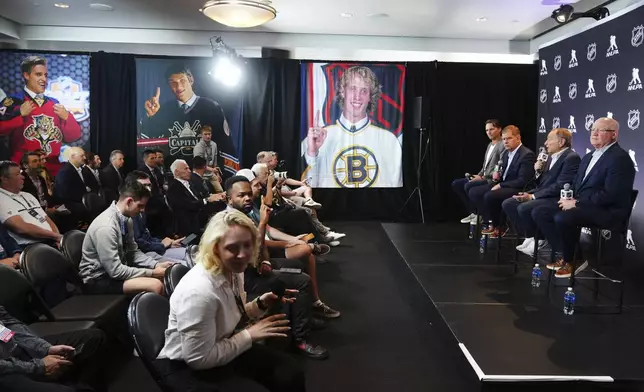 On stage from left to right, Ron Hainsey, NHLPA Assistant Executive Director; Marty Walsh, NHLPA Executive Director; Gary Bettman, NHL Commissioner, and Bill Daly, NHL Deputy Commissioner, conduct a joint press conference before the NHL hockey draft Friday, June 27, 2025, in Los Angeles. (AP Photo/Damian Dovarganes)