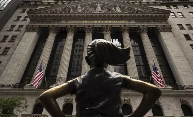 The "Fearless Girl" statue stands in front of the New York Stock Exchange, Wednesday, June 18, 2025, in New York. (AP Photo/Yuki Iwamura)