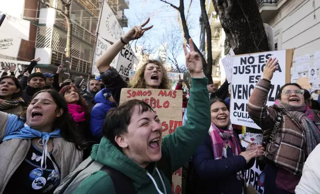 Supporters of Argentina's former President Cristina Fernandez protest in her defense after she began serving a six-year prison sentence under house arrest for corruption, in Buenos Aires, Argentina, Wednesday, June 18, 2025. (AP Photo/Gustavo Garello)