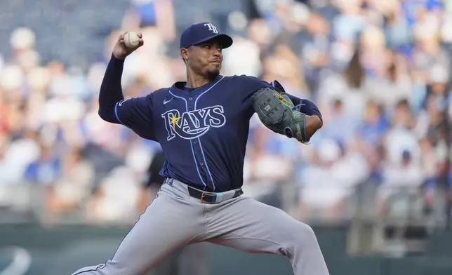 Tampa Bay Rays starting pitcher Taj Bradley throws during the first inning of a baseball game against the Kansas City Royals, Tuesday, June 24, 2025, in Kansas City, Mo. (AP Photo/Charlie Riedel)