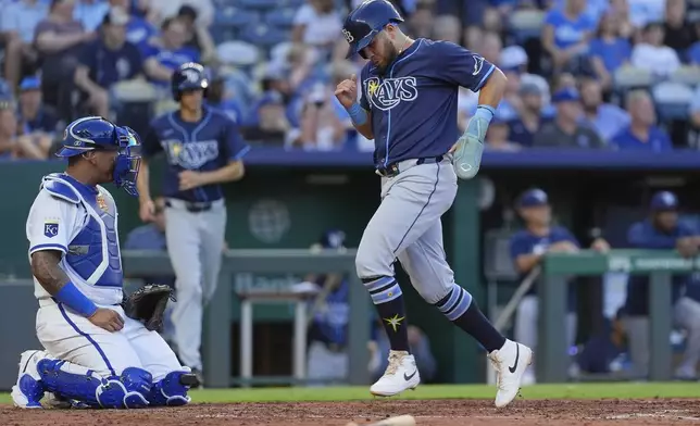 Tampa Bay Rays' Jonathan Aranda runs home to score on a sacrifice fly hit by Danny Jansen during the fourth inning of a baseball game against the Kansas City Royals, Tuesday, June 24, 2025, in Kansas City, Mo. (AP Photo/Charlie Riedel)