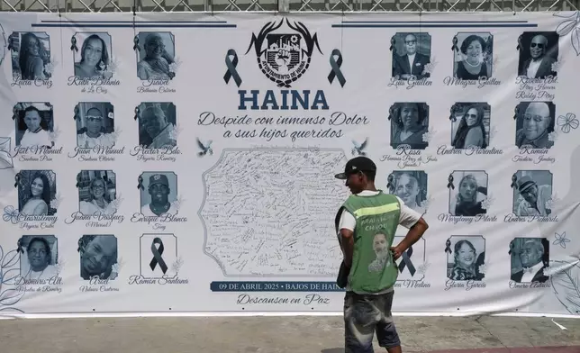FILE - A banner with images of some of the victims of the Jet Set nightclub roof collapse that killed more than 200 people, is displayed on a facade in Haina, Dominican Republic, April 10, 2025. (AP Photo/Matias Delacroix, File)