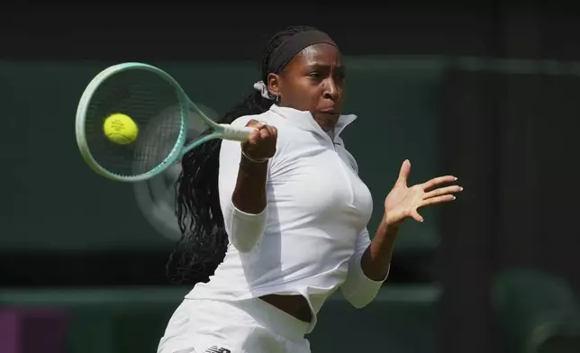 Coco Gauff of United States hits a return to Aryna Sabalenka of Belarus during a practice session ahead of the Wimbledon Championships in London, Friday, June 27, 2025. (AP Photo/Joanna Chan)