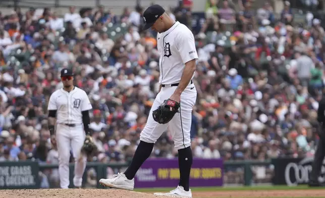 Detroit Tigers pitcher Jack Flaherty reacts on the mound after allowing a Cincinnati Reds' Cincinnati Reds' Tyler Stephenson grand slam in the fifth inning during a baseball game, Saturday, June 14, 2025, in Detroit. (AP Photo/Paul Sancya)