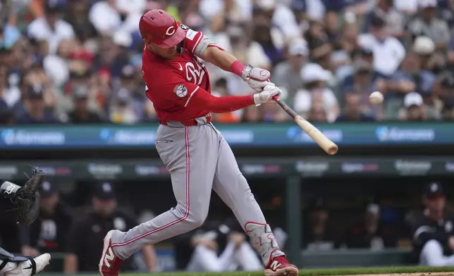Cincinnati Reds' Tyler Stephenson hits a grand slam against the Detroit Tigers in the fifth inning during a baseball game, Saturday, June 14, 2025, in Detroit. (AP Photo/Paul Sancya)