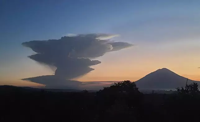 Volcanic smoke billows from Mount Lewotobi Laki-Laki during an eruption, as seen from Lembata, Indonesia, Tuesday, June 17, 2025. (AP Photo/Andre Kriting)