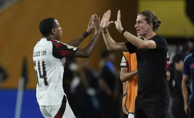 Flamengo's Wallace Yan celebrates his team's first goal during the Club World Cup Group D soccer match between Los Angeles FC and Flamengo in Orlando, Fla., Tuesday, June 24, 2025. (AP Photo/John Raoux)