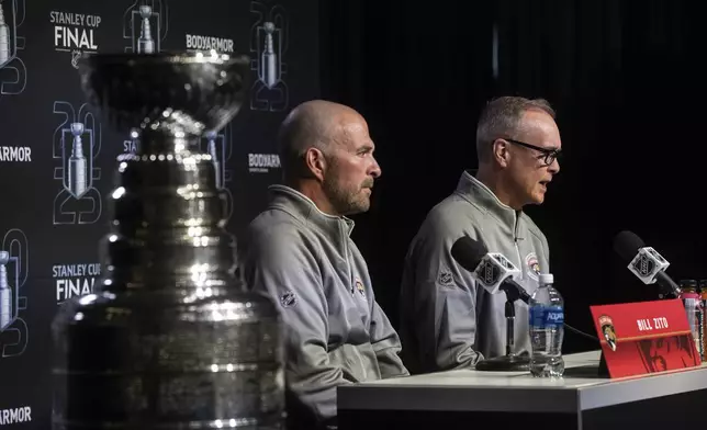 Florida Panthers' general manager Bill Zito, left, and head coach Paul Maurice speak to media during a news conference, Tuesday, June 3, 2025, in Edmonton, Alberta, ahead of Game 1 of the NHL hockey Stanley Cup final series against the Edmonton Oilers. (Jason Franson/The Canadian Press via AP)