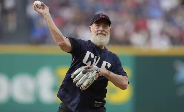 Actor J.K. Simmons throws out a ceremonial first pitch before a baseball game between the St.Louis Cardinals and the Cleveland Guardians in Cleveland, Friday, June 27, 2025. (AP Photo/Sue Ogrocki)