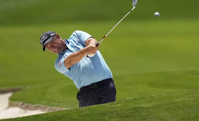 FILE - Padraig Harrington, of Ireland, hits from the bunker on the 18th hole during the first round of the PGA Championship golf tournament at the Quail Hollow Club, May 15, 2025, in Charlotte, N.C. (AP Photo/David J. Phillip, File)