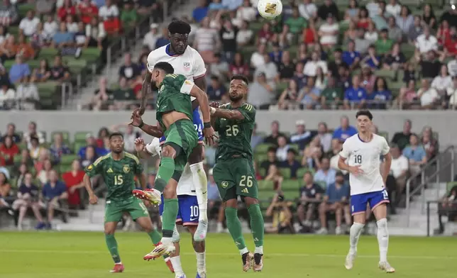 United States' Patrick Agyemang (24) leaps between Saudi Arabia's Abdulelah Alamri (4) and Ali Majrashi (26) and heads the ball towards the goal during a CONCACAF Gold Cup soccer match, Thursday, June 19, 2025, in Austin, Texas. (AP Photo/Eric Gay)