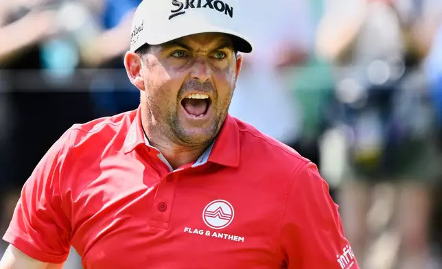 Keegan Bradley reacts to making birdie putt to a tie for the lead on the ninth hole during the final round of the Travelers Championship golf tournament at TPC River Highlands, Sunday, June 22, 2025, in Cromwell, Conn. (AP Photo/Jessica Hill)