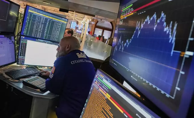 Specialist Meric Greenbaum works at his post on the floor of the New York Stock Exchange, Tuesday, June 10, 2025. (AP Photo/Richard Drew)