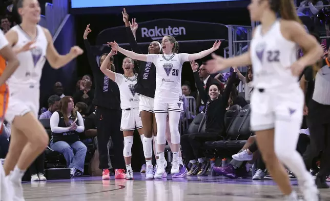 Golden State Valkyries' Kate Martin and Kaitlyn Chen celebrate a Veronica Burton 3-pointer during the second quarter of a WNBA basketball game against the against Connecticut Sun, Sunday, June 22, 2025, in San Francisco.(Scott Strazzante/San Francisco Chronicle via AP)